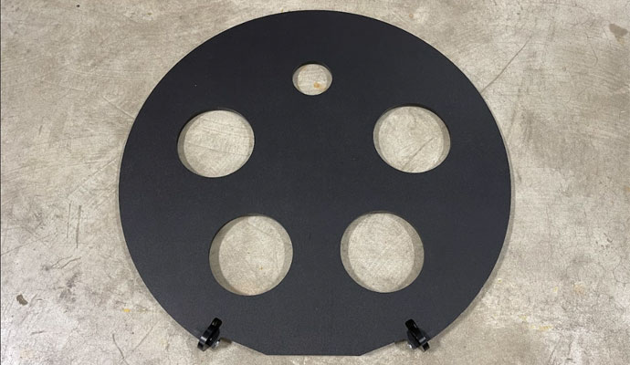 Black circular conduit spacer plate with cutouts